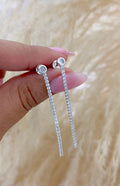 Arete tira circón