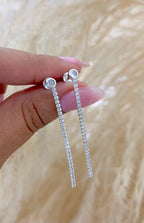 Arete tira circón